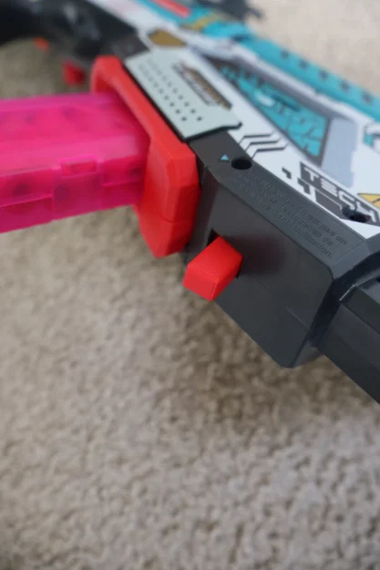 Nút tháo băng đạn mở rộng (Extended Mag Release) cho X-Shot Longshot - Image 2