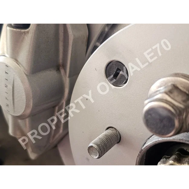 Nắp đậy lỗ kiểm tra đĩa phanh Nissan / Infiniti - Image 1