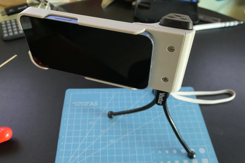 Báng cầm máy ảnh cho iPhone 14 - Image 1
