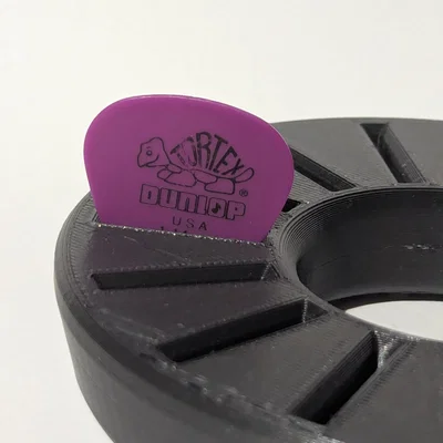 Hộp đựng phím đàn guitar hình tròn
